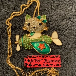 On sale! BJ Hello Kitty is in the sky in a mint green and rhinestone airplane.